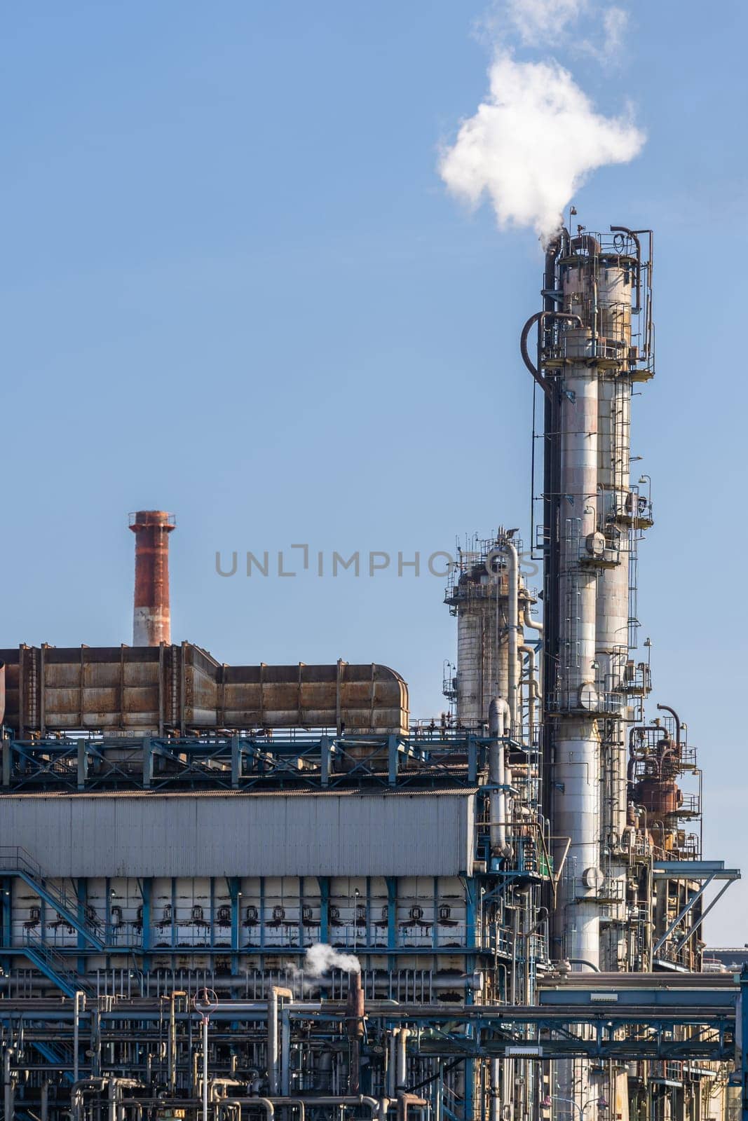 Oil petrochemical Factory plant with gas storage and structure of pipeline with smoke from smokestack in Kawasaki City near Tokyo Japan