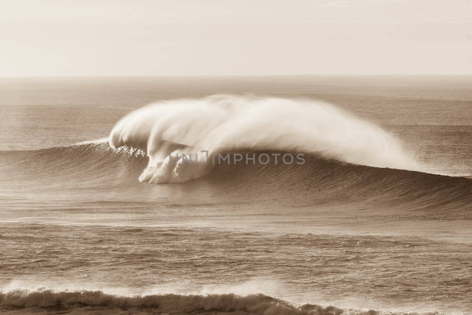 Wave crashing hollow water ocean sea power with spray vintage sepia tone