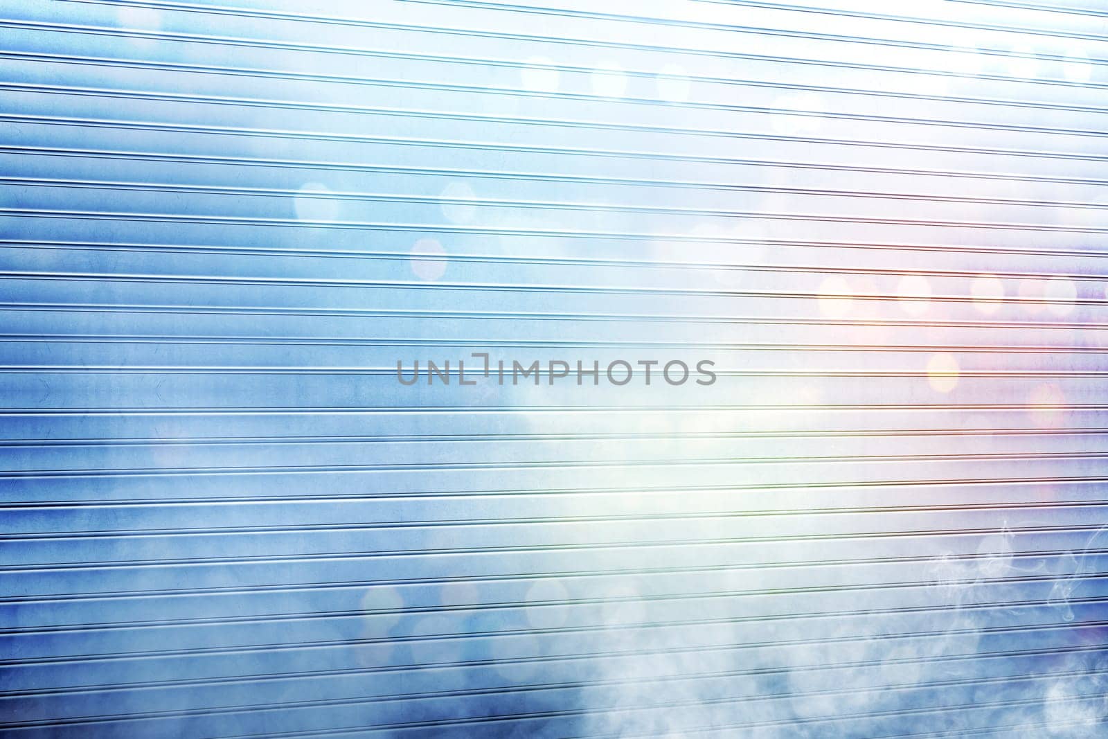 White roller shutter door with smoke and colorful light reflection on metal background
