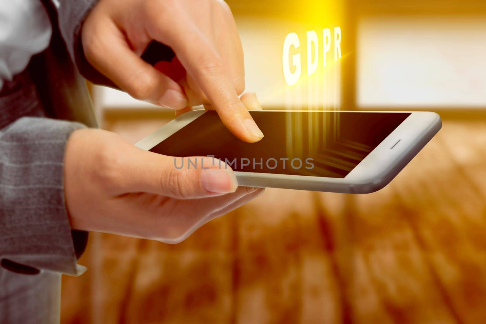 Business woman touching the mobile phone screen and display GDPR text with office room background. Cyber security and privacy. General Data Protection Regulation (GDPR) concept
