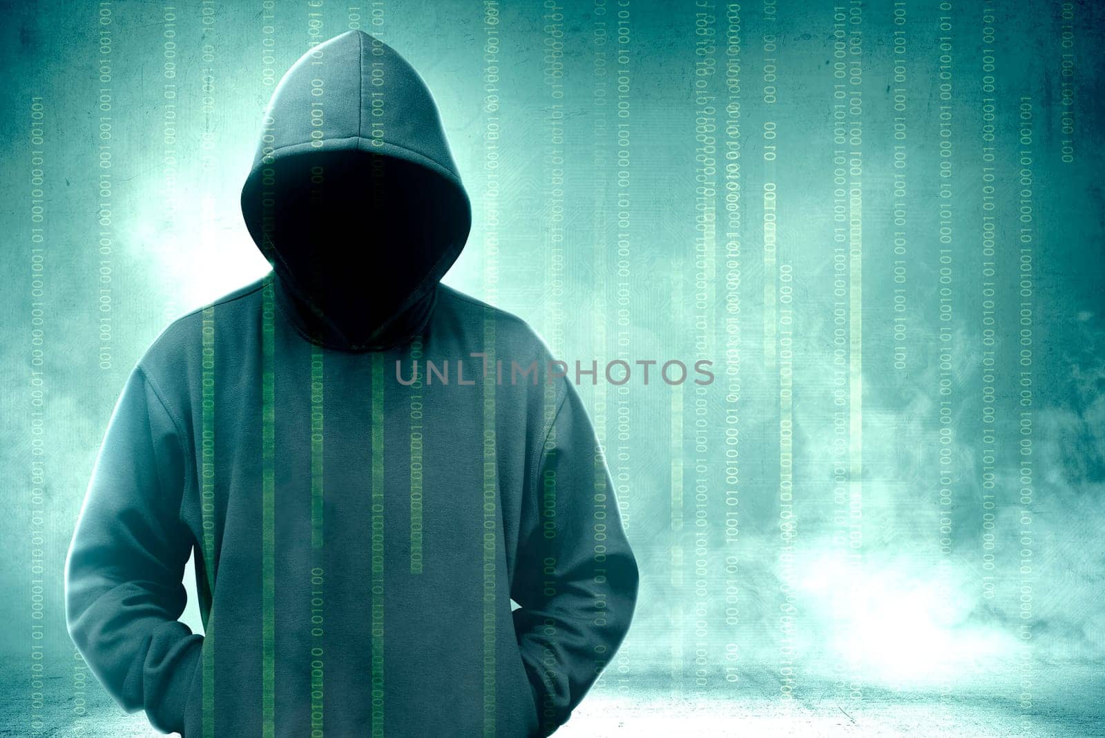 Hacker in black hoodie standing with binary code on virtual screen over green background