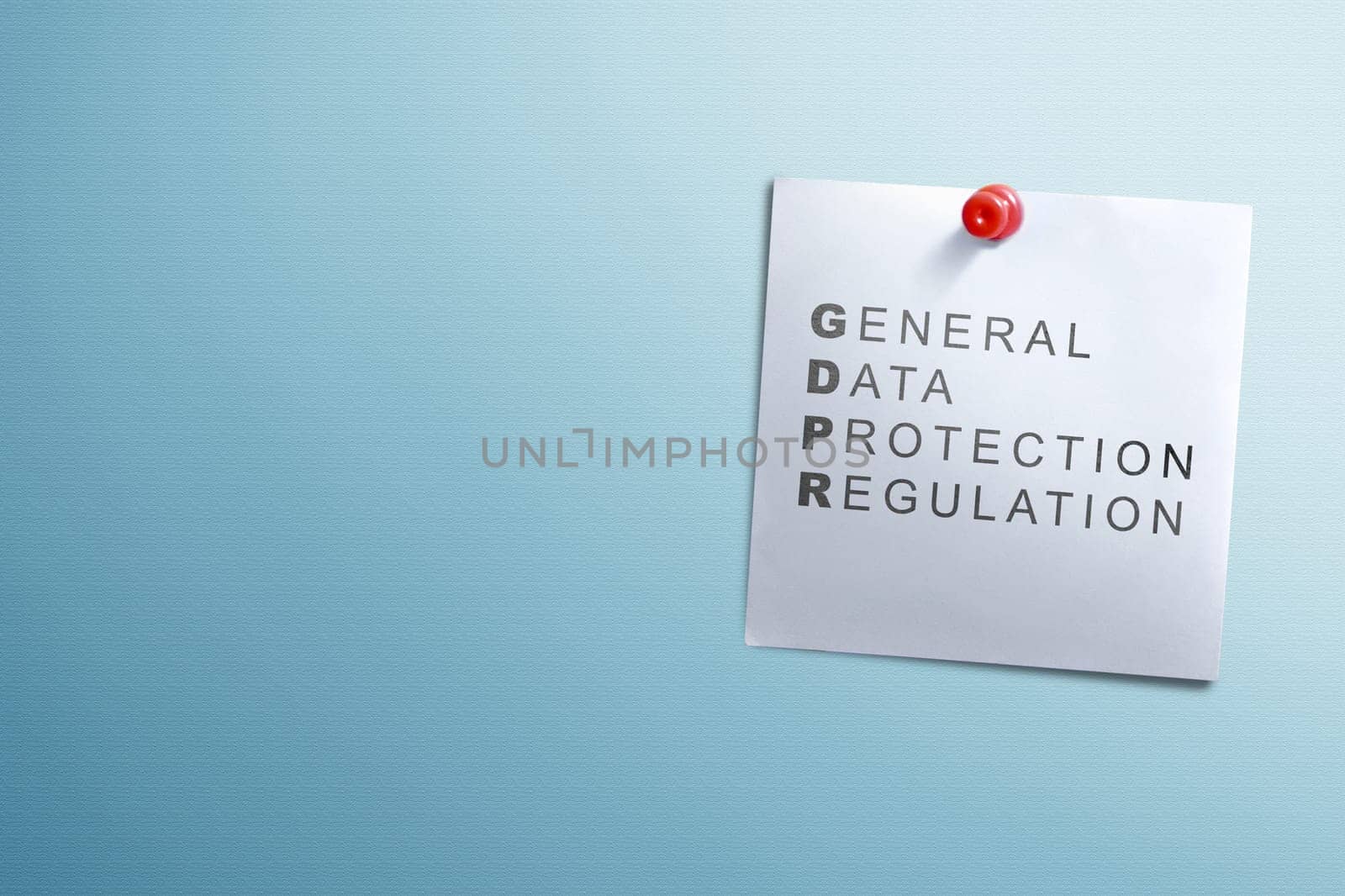 White notes paper with General Data Protection Regulation text hanging on the wall. Cyber security and privacy. General Data Protection Regulation (GDPR) concept
