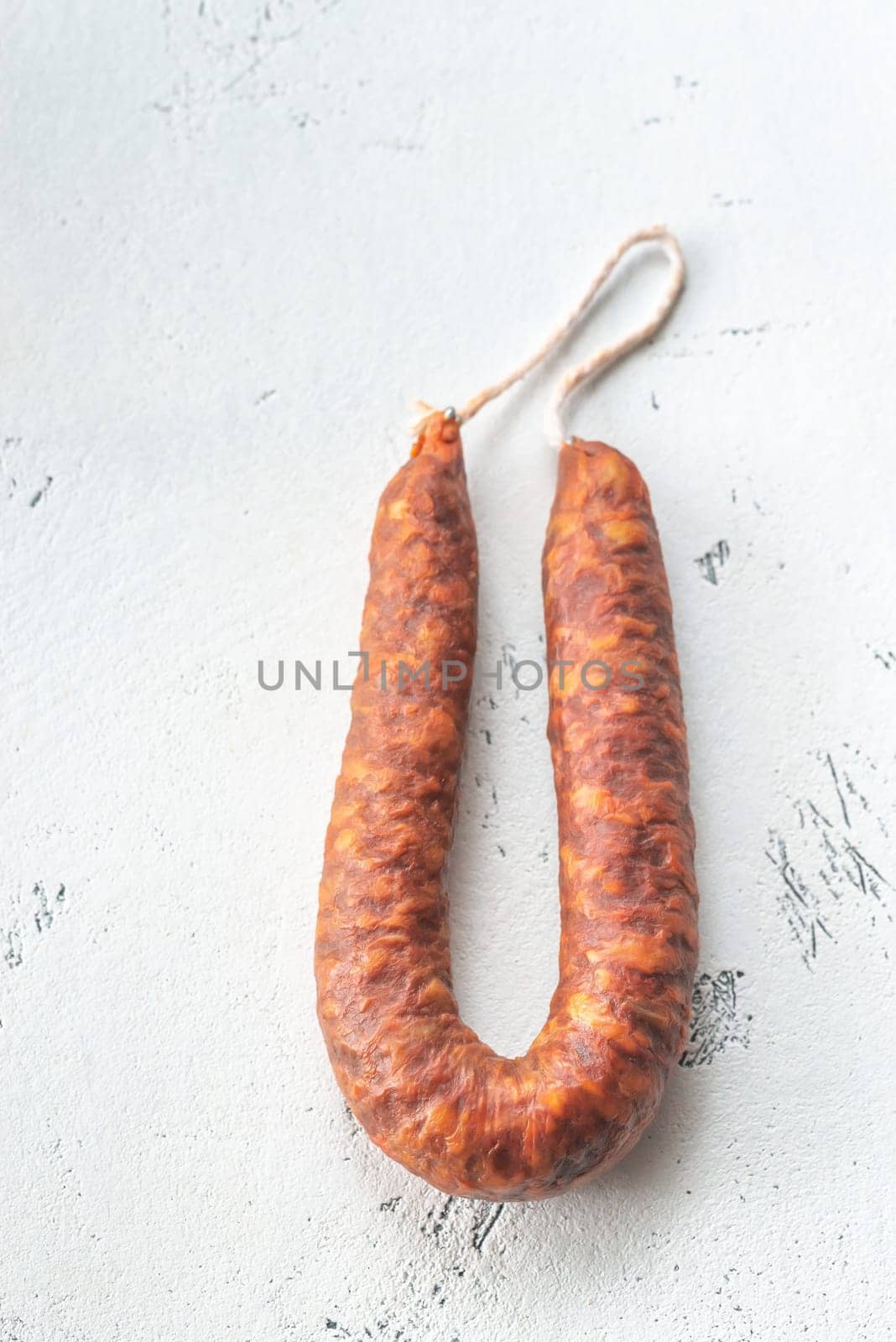 Spanish chorizo sausage on the white background