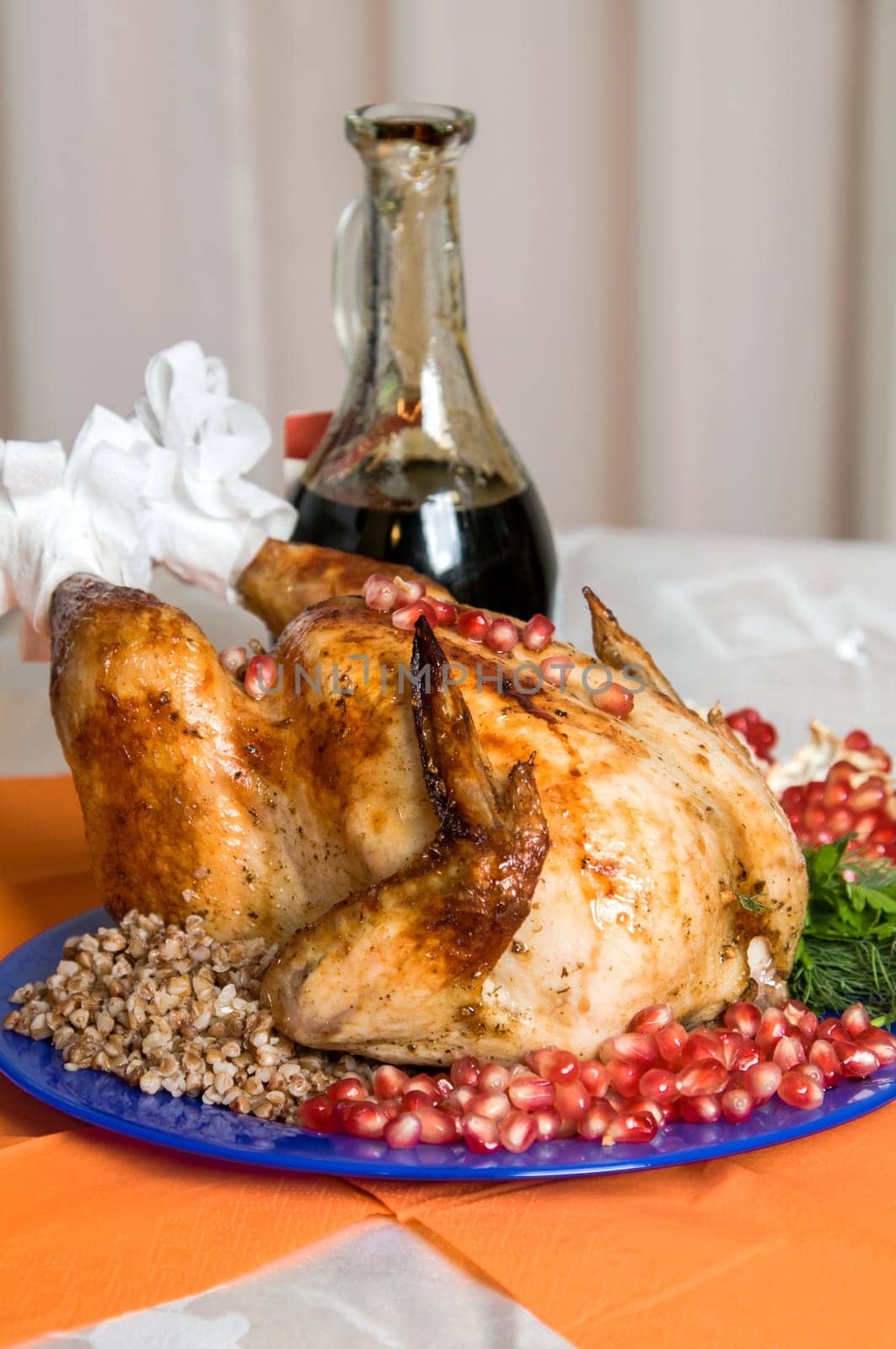 whole fried chicken cooked with buckwheat porridge and pomegranate