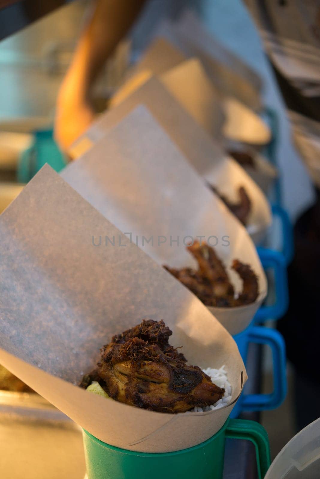 Traditional Malay food, takeaway fragrant rice with fried chicken.