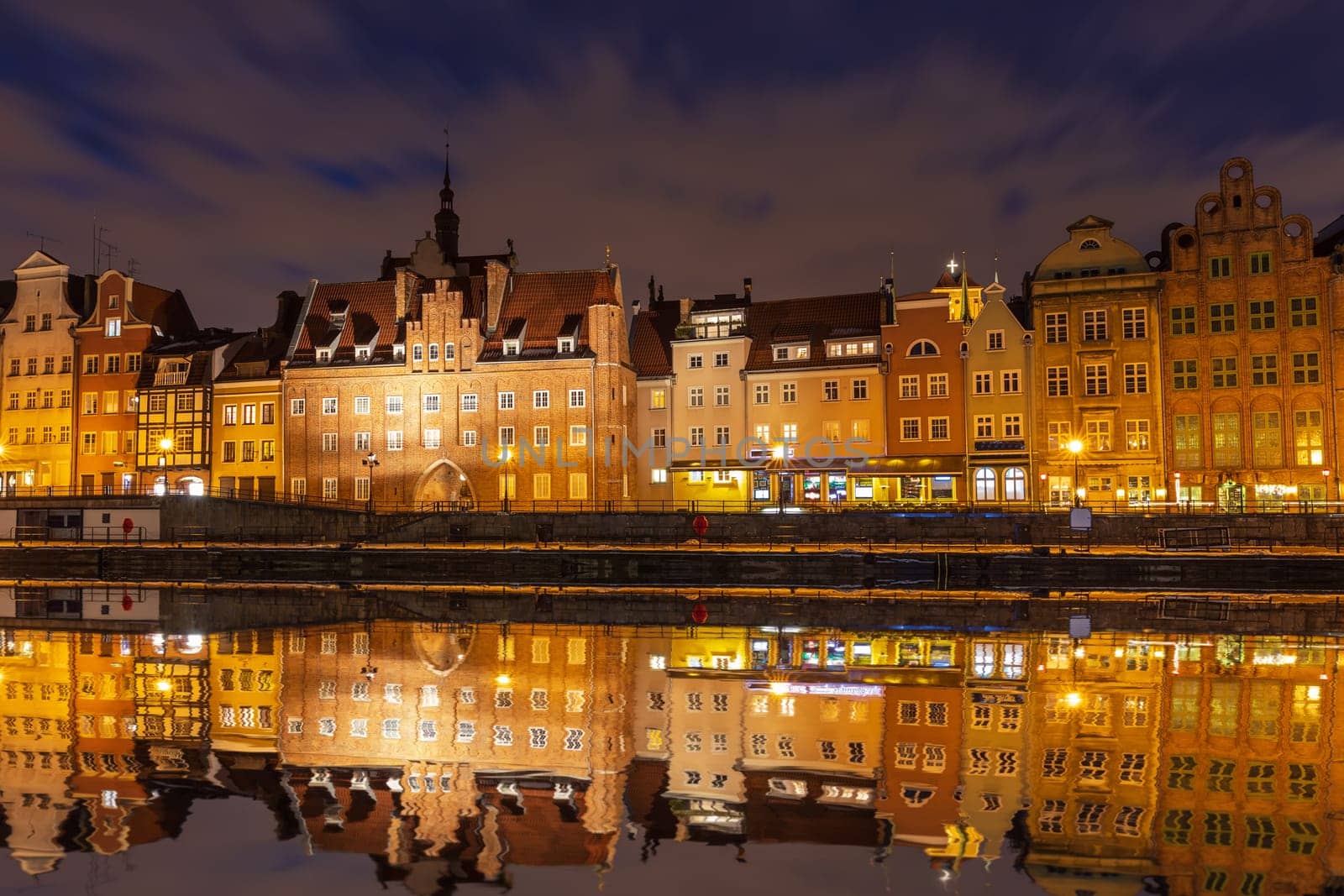 Gdansk night view, Motlawa river and Old Town houses, Poland.