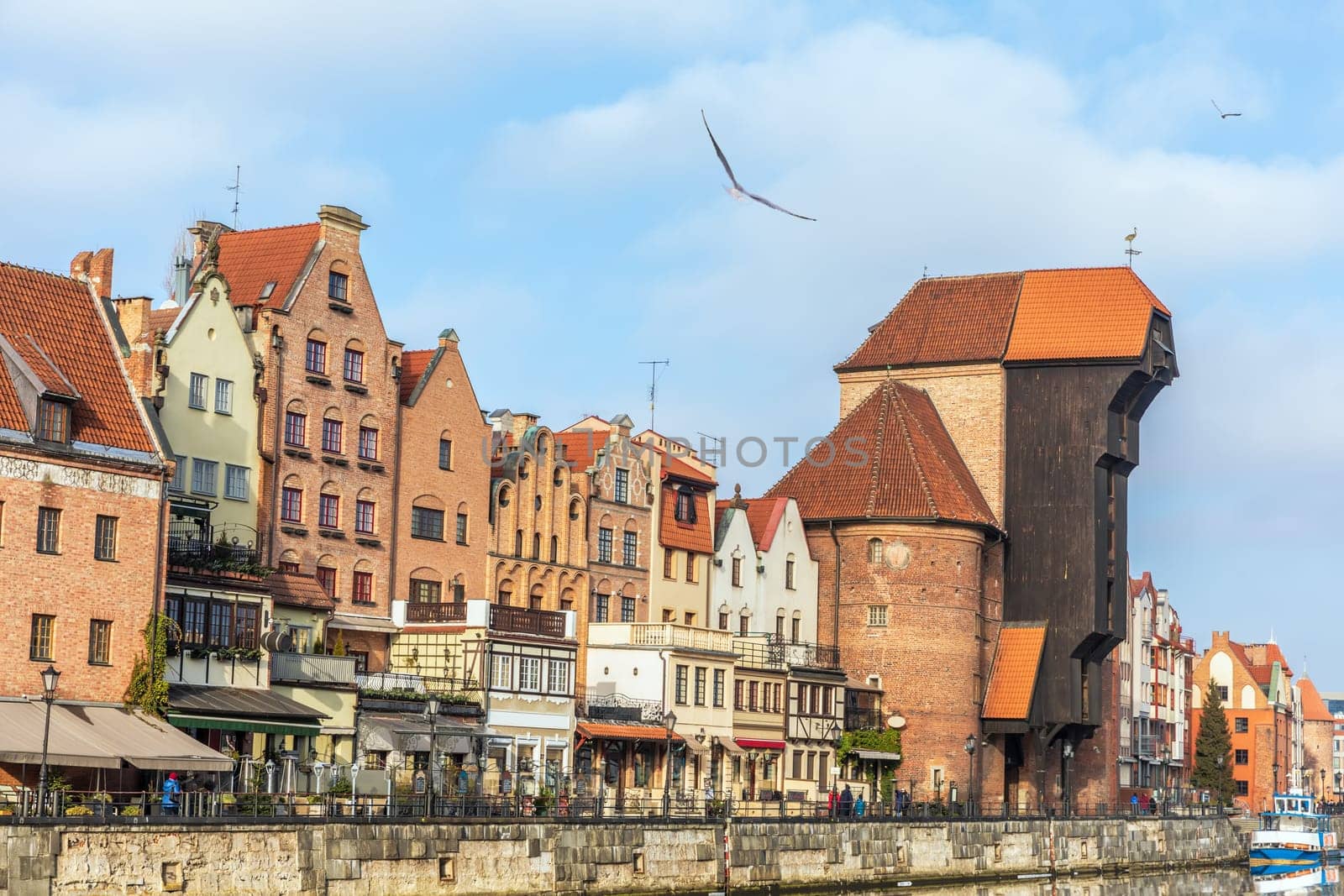 Promenade in Gdansk by the Motlawa river, view on Zuraw Port Crane.