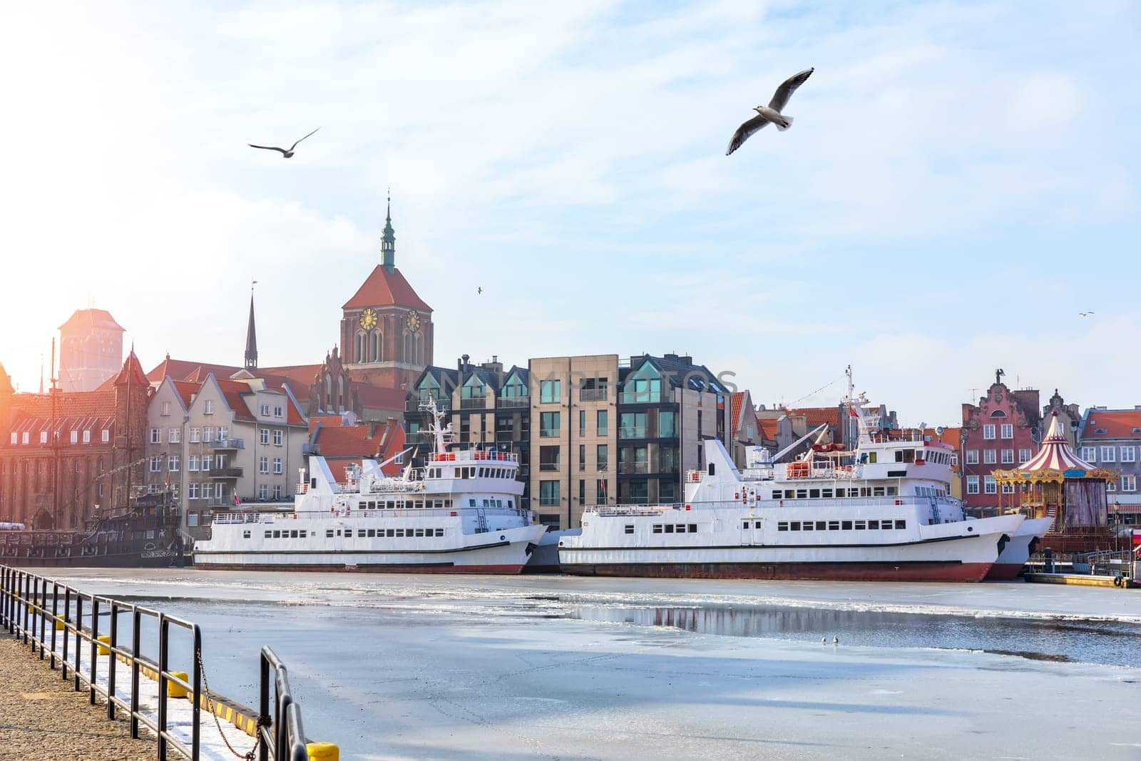 Ships in the Motlawa and the domes of the churches, Gdansk, Poland.