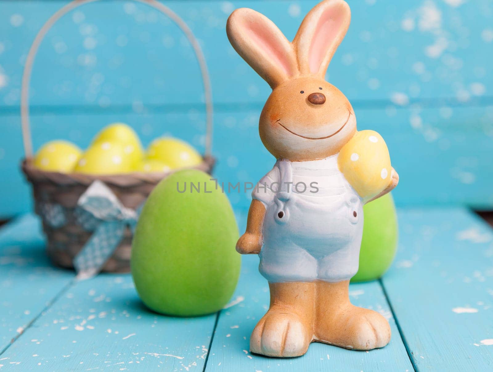 Traditional Easter holiday bunny and eggs on white background