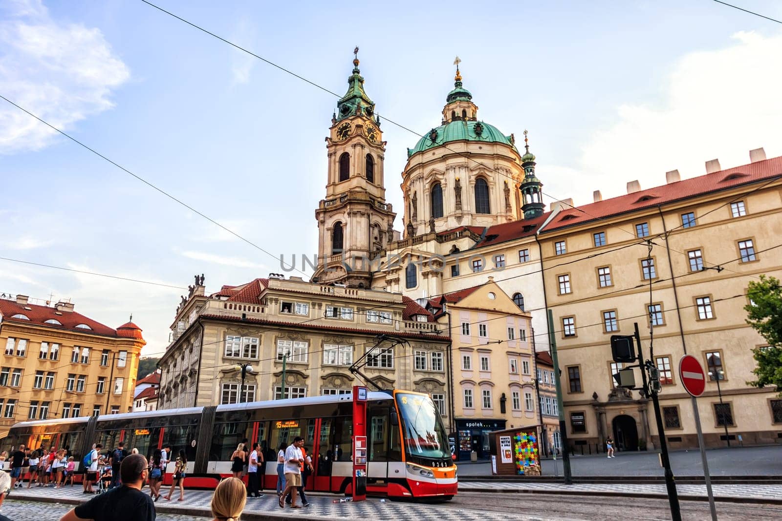Prague, Czech Republic - August 18, 2018: Malostranske namesti - a square in Prague, St. Nicholas Church and a tram stop