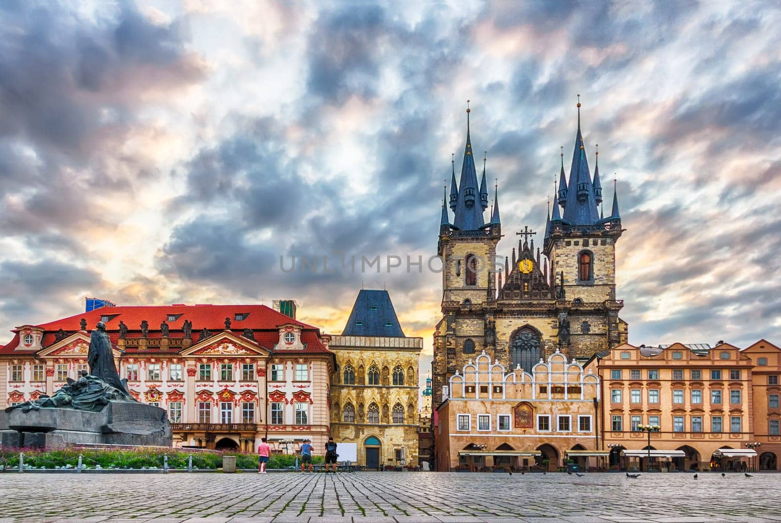 Old Town Square with Jan Hus Memorial, Kinsky Palace, the Church of Our Lady before Tyn and the Stone Bell House in Prague.