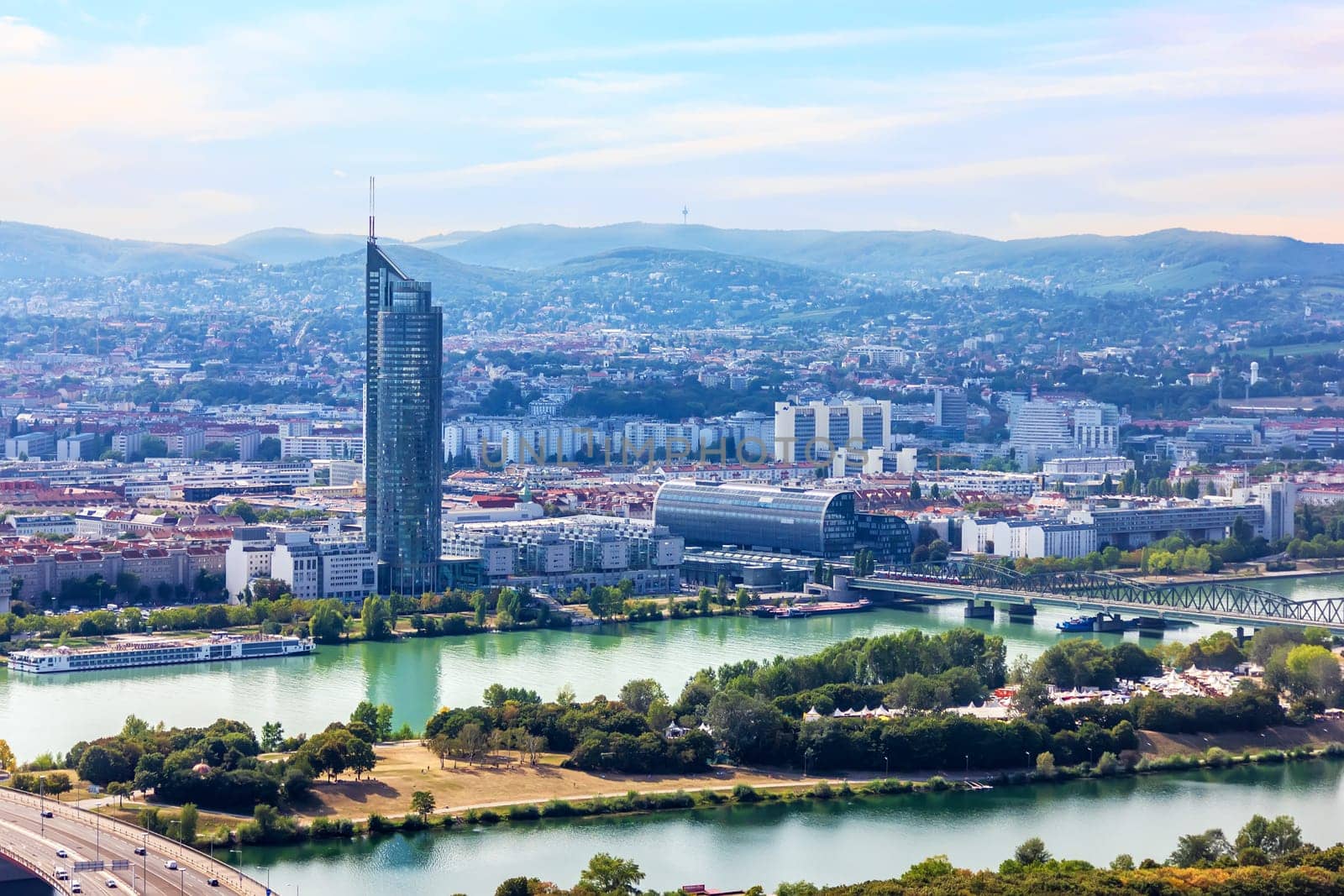 Towers in the modern district of Vienna and the bridges over the Danube.