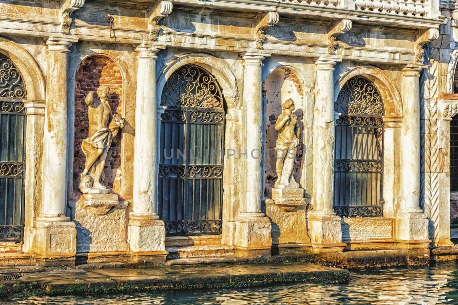 Statues on the facade of Giusti Palace on the Grand Canal of Venice, Italy.