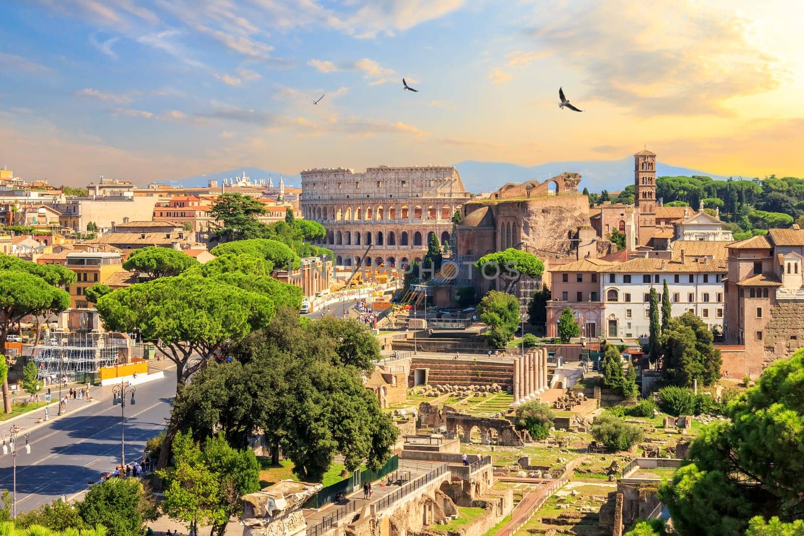 Coliseum and Roman Forum, beautiful sunset view.