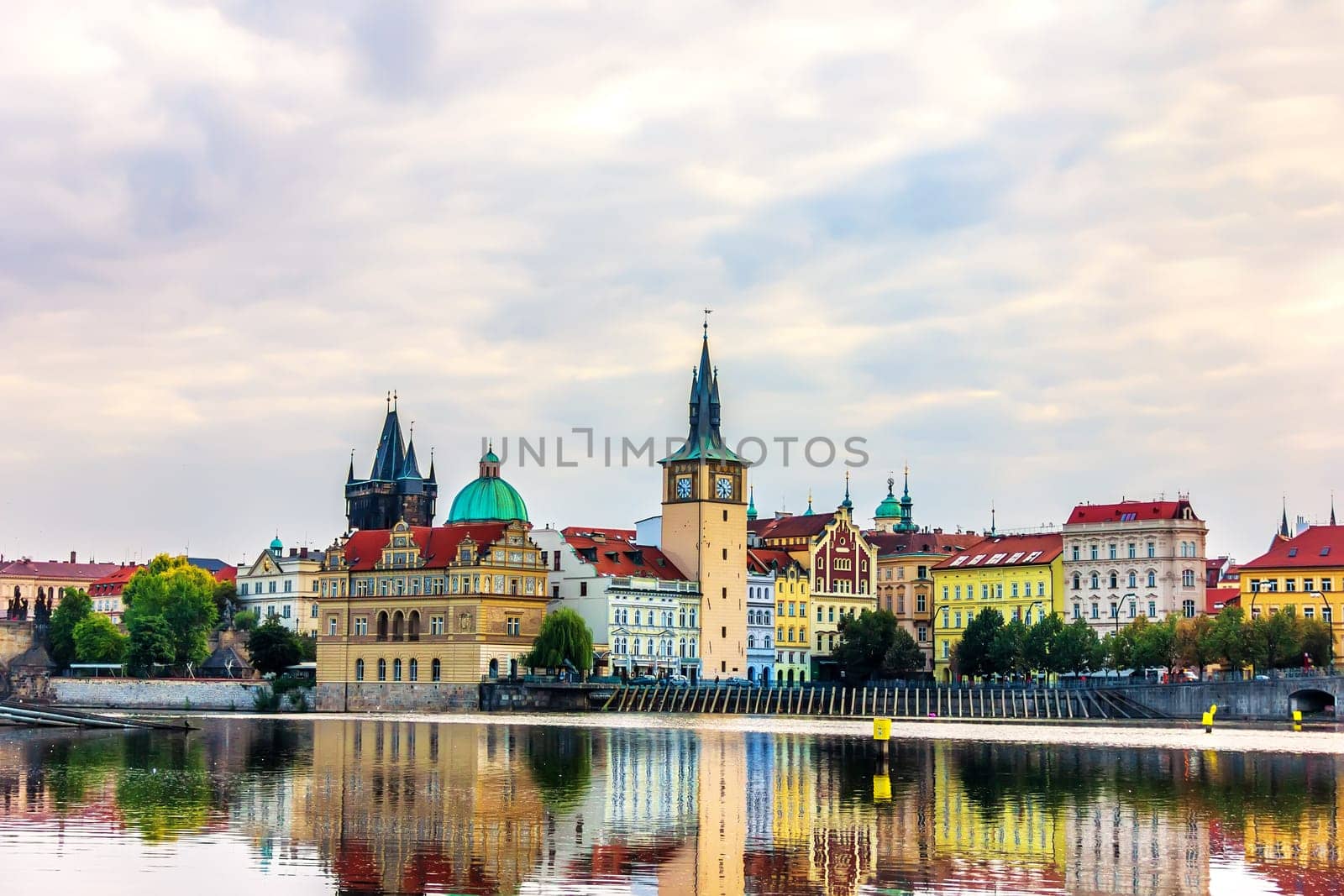 Old Town Tower and the famous walking bridge in Prague, view from the Vltava.