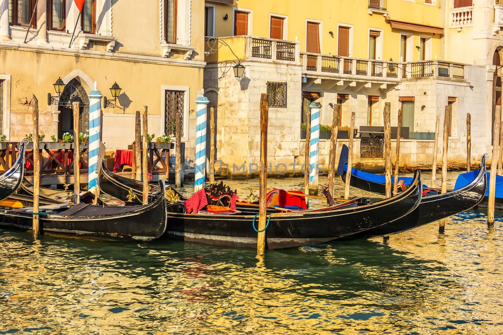 Gondolas moored on the Grand Canal of Venice, Italy.