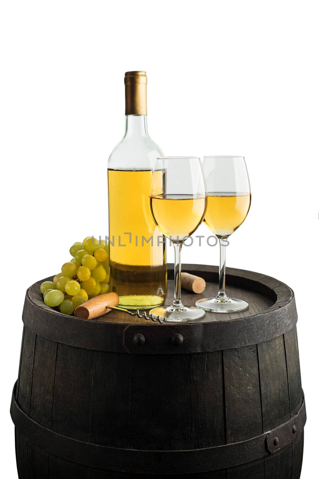 Bottle of white wine on old barrel isolated on white. Wine bottle background.