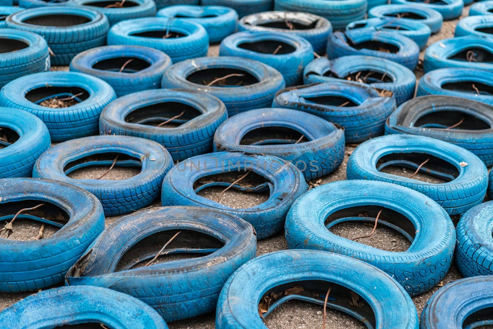 Budva, Montenegro - April 2018 : Pile of old discarded tyres left on the ground