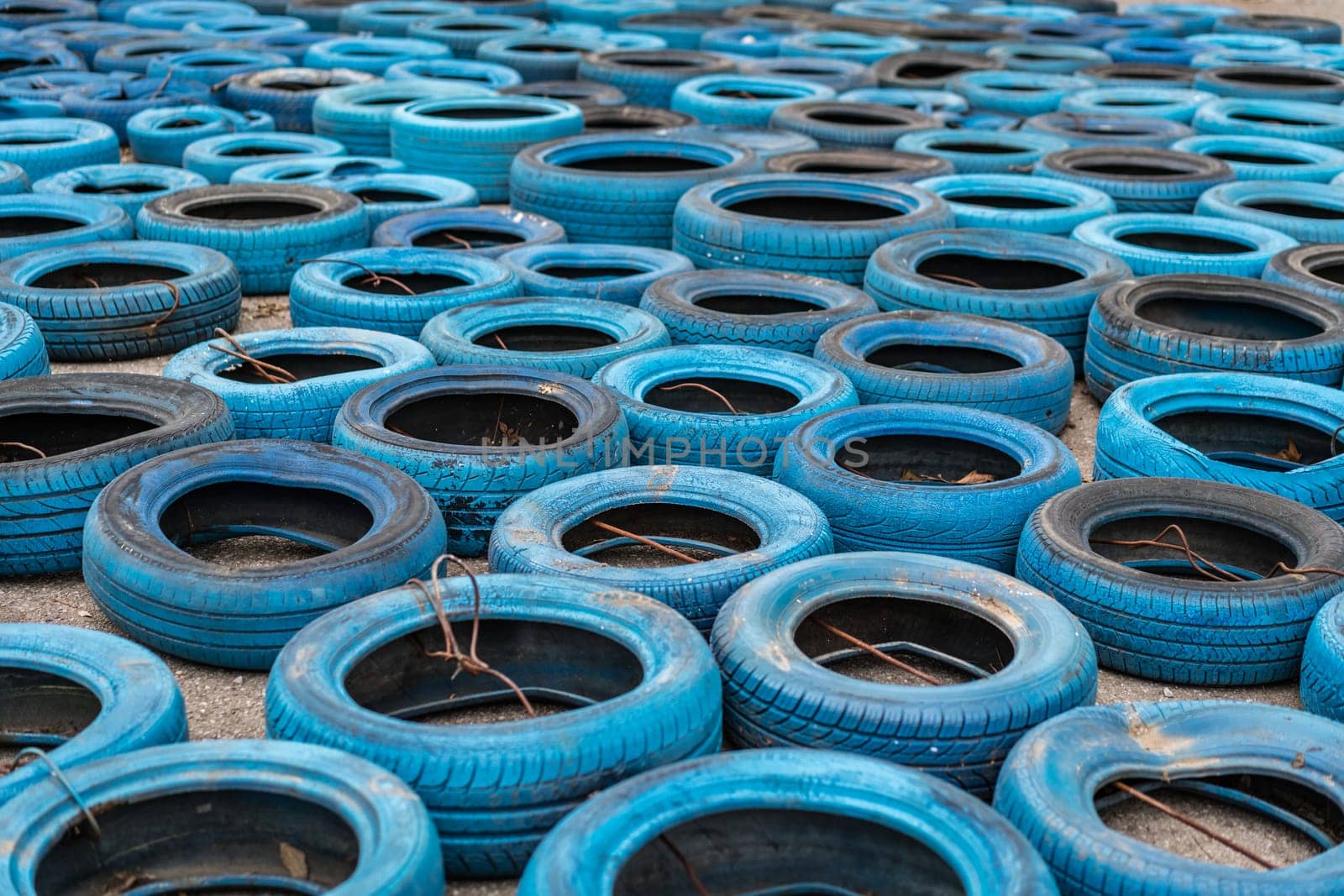 Budva, Montenegro - April 2018 : Pile of old discarded tyres left on the ground