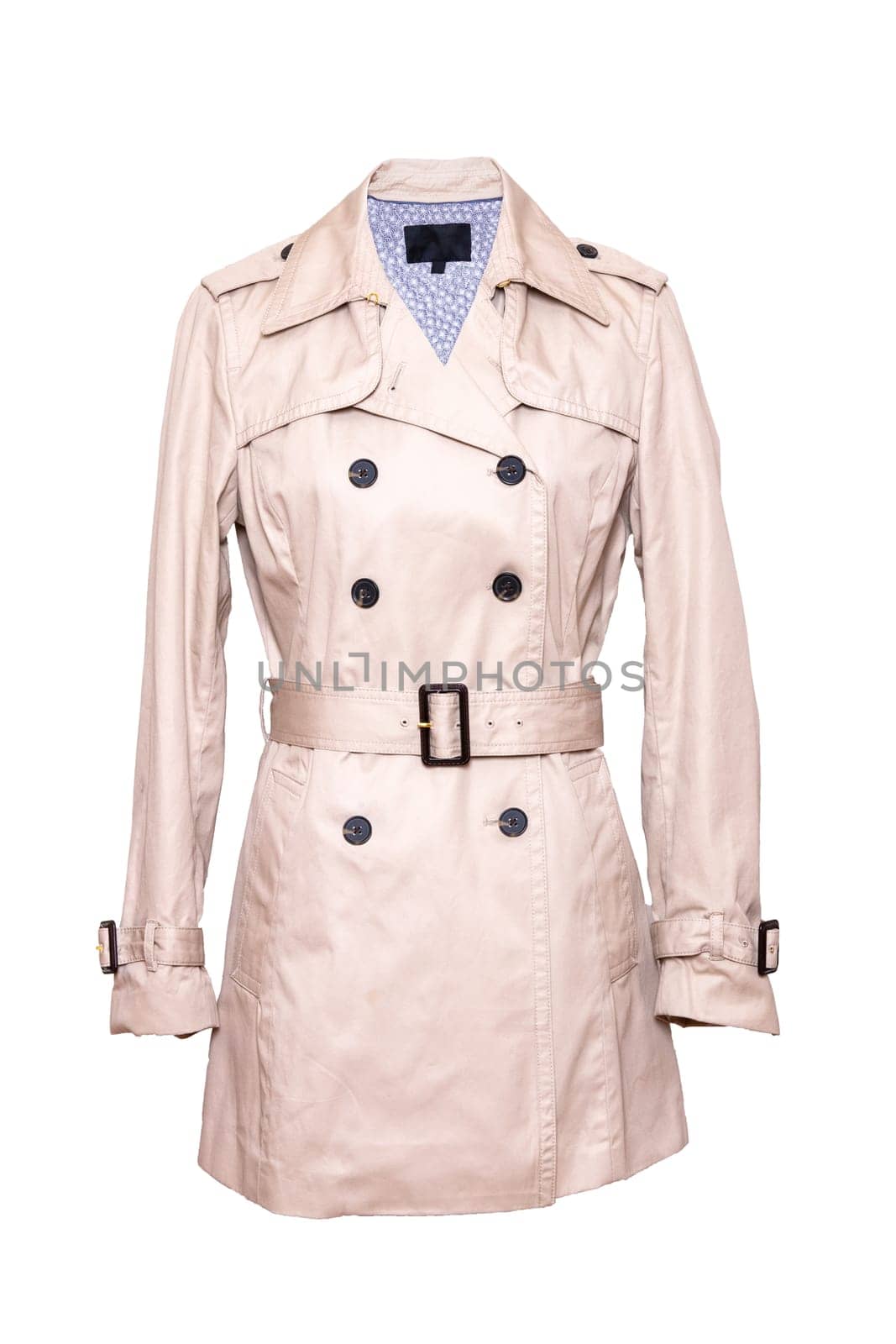 Woman coat isolated. A luxurious and stylish elegant female beige trenchcoat on mannequin isolated on a white background. Spring fashion 2019. Back view.