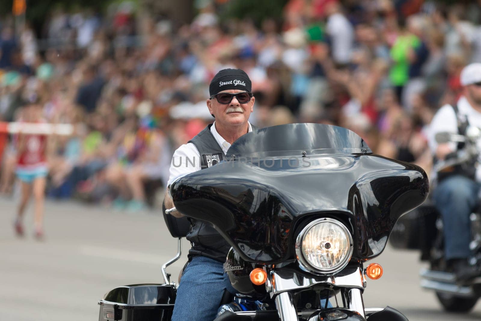 Indianapolis, Indiana, USA - May 26, 2018, A groups of Bikers going down the street at the Indy 500 Parade