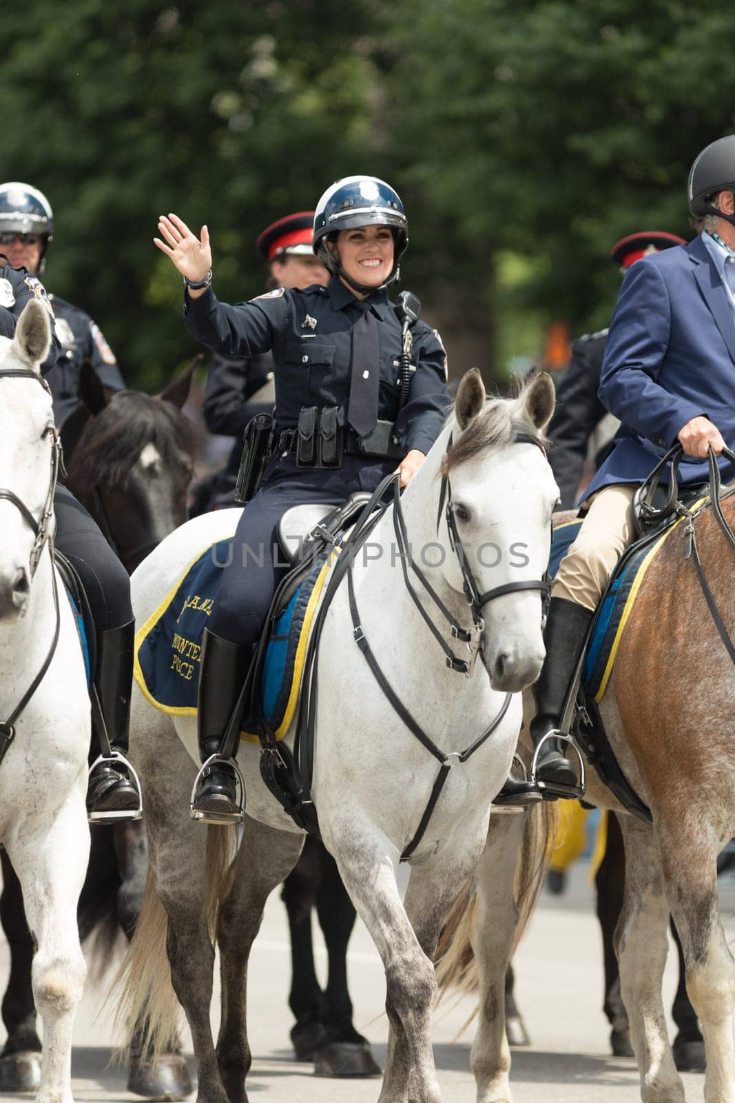 Indianapolis, Indiana, USA - May 26, 2018, Police officers on horses going down the street at the Indy 500 Parade