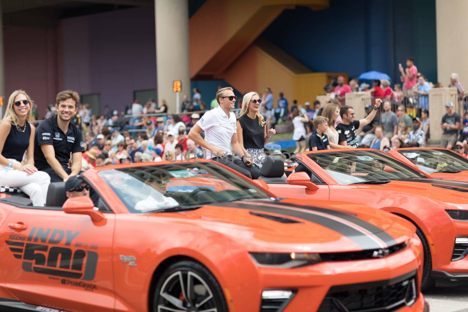 Indianapolis, Indiana, USA - May 26, 2018, Indycar drivers  Carlos Muñoz, Max Chilton and  James Davison going down the road at the Indy 500 Parade