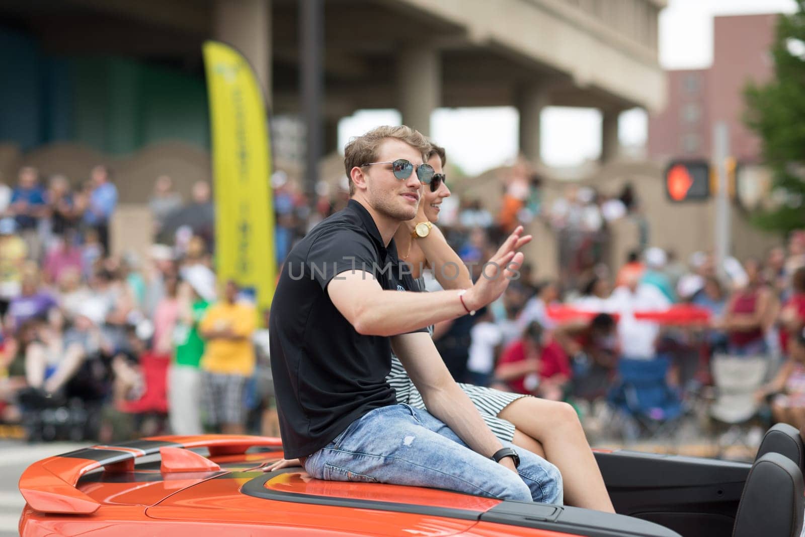 Indianapolis, Indiana, USA - May 26, 2018, Sage Karam Indycar driver goes down the road  at the Indy 500 Parade