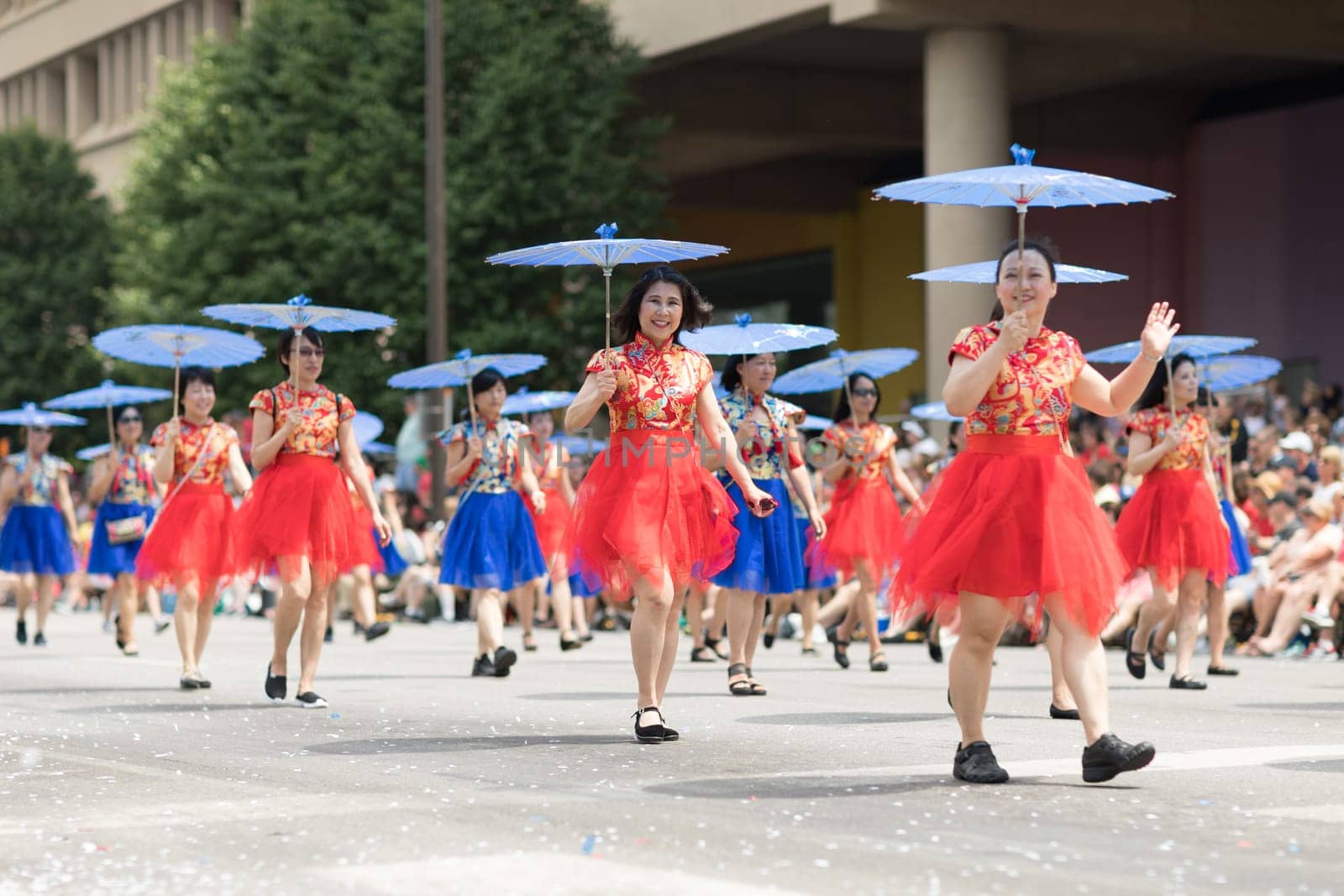 Indianapolis, Indiana, USA - May 26, 2018, Women wearing traditional chinese clothing and holding umbrellas from the Confucius Institute Indianapolis, from the IUPUI University  at the Indy 500 Parade