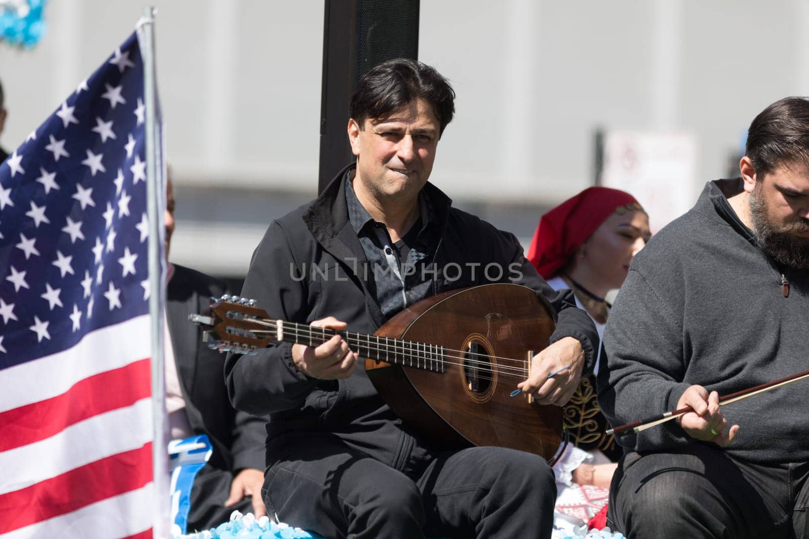 Chicago, Illinois, USA - April 29, 2018  Greek man playing the lavouto during the Greek Independence  Day Parade