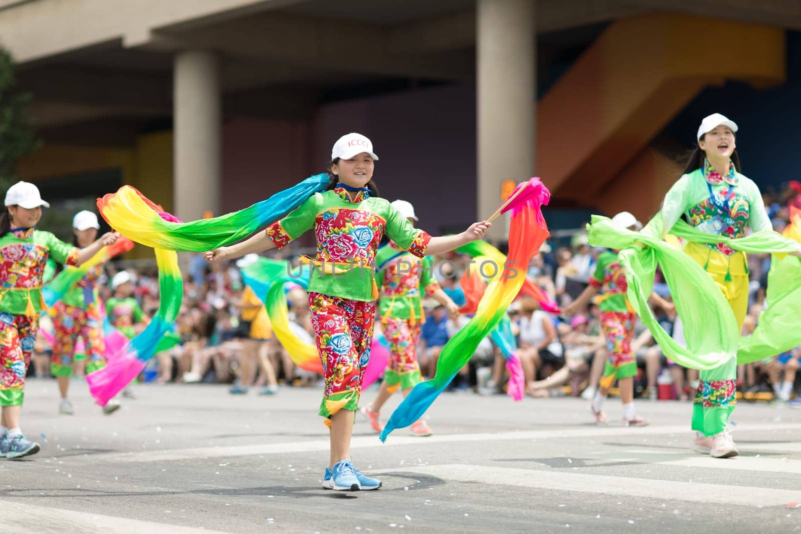 Indianapolis, Indiana, USA - May 26, 2018, Members of the Indianapolis Chinese Community Center, Inc.  Dancing while holding ribbons with their hands wearing traditional clothing at the Indy 500 Parade