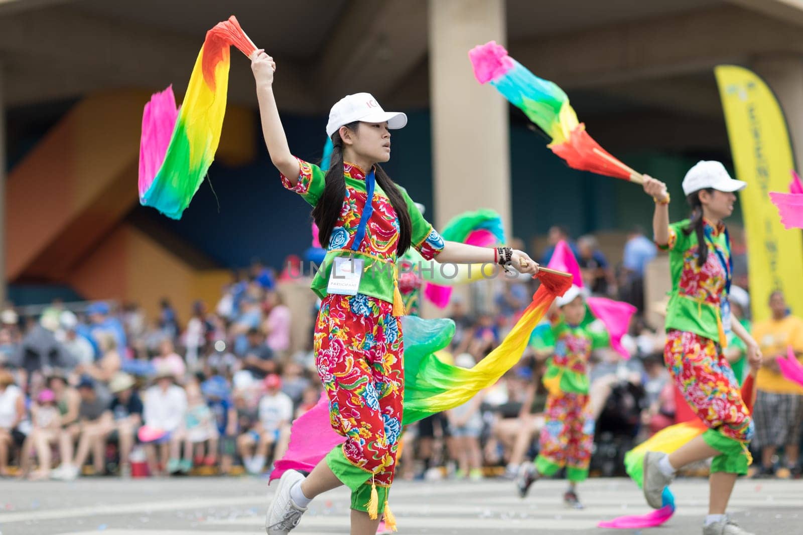 Indianapolis, Indiana, USA - May 26, 2018, Members of the Indianapolis Chinese Community Center, Inc.  Dancing while holding ribbons with their hands wearing traditional clothing at the Indy 500 Parade