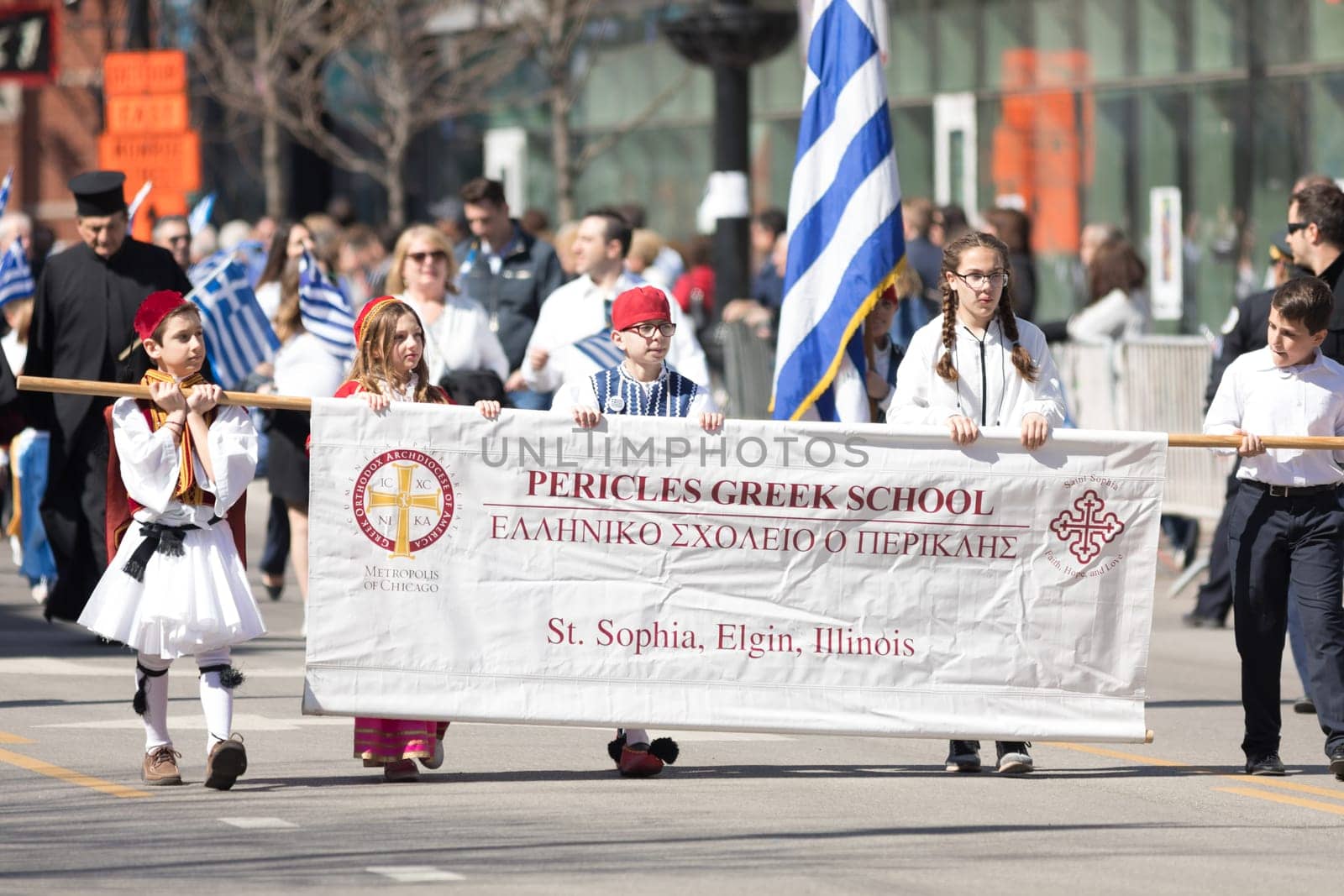 Chicago, Illinois, USA - April 29, 2018  Members of the Pericles Greek School wearing traditional clothing marching at the Greek Independence  Day Parade