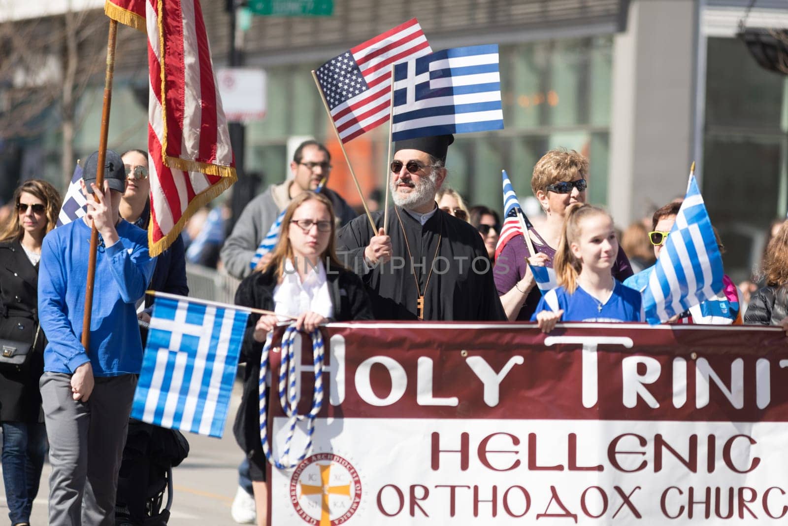 Chicago, Illinois, USA - April 29, 2018  Member of the holy Trinity Hellenic Orthodox Church at the Greek Independence  Day Parade