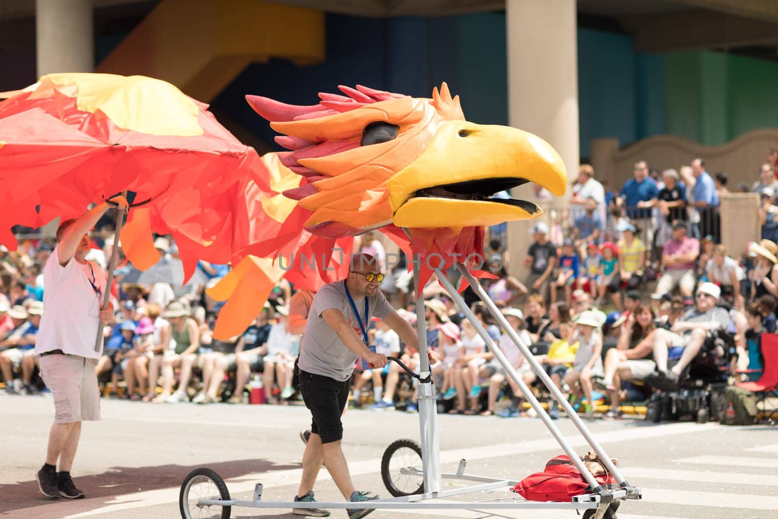 Indianapolis, Indiana, USA - May 26, 2018, People push a float in shape of a red bird  at the Indy 500 Parade