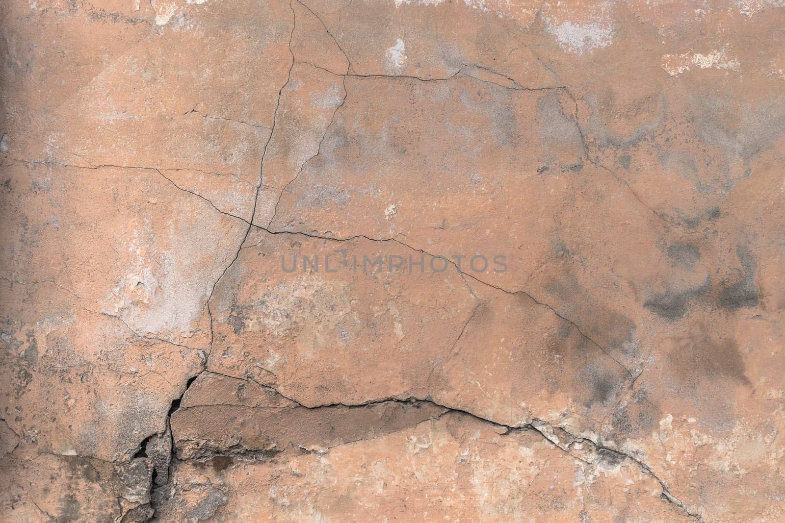 cracked red wall. Ideal for texture and background.