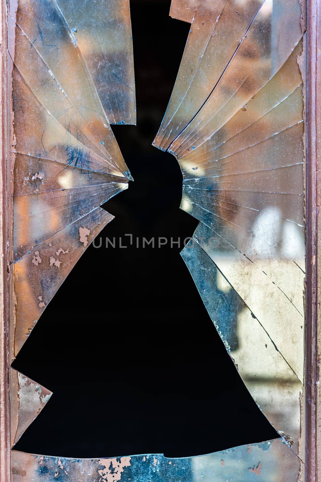 Shattered door glass window with sharp edges