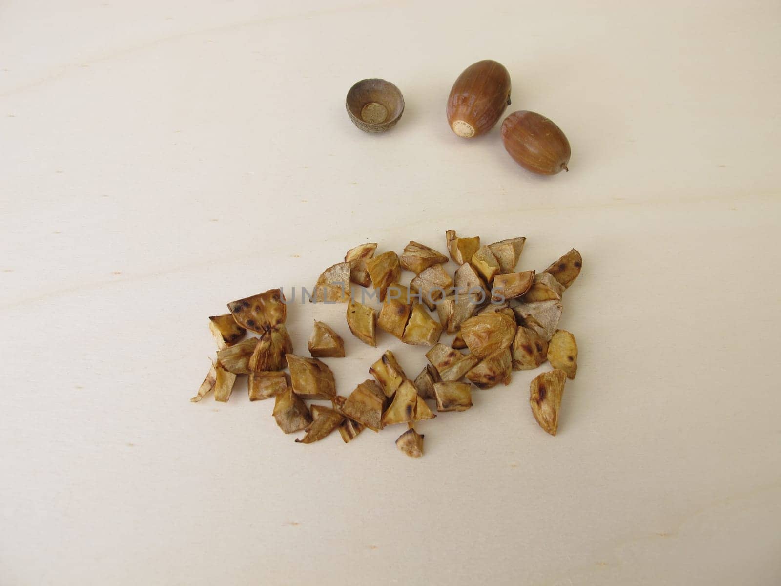 Roasted acorns on wooden board