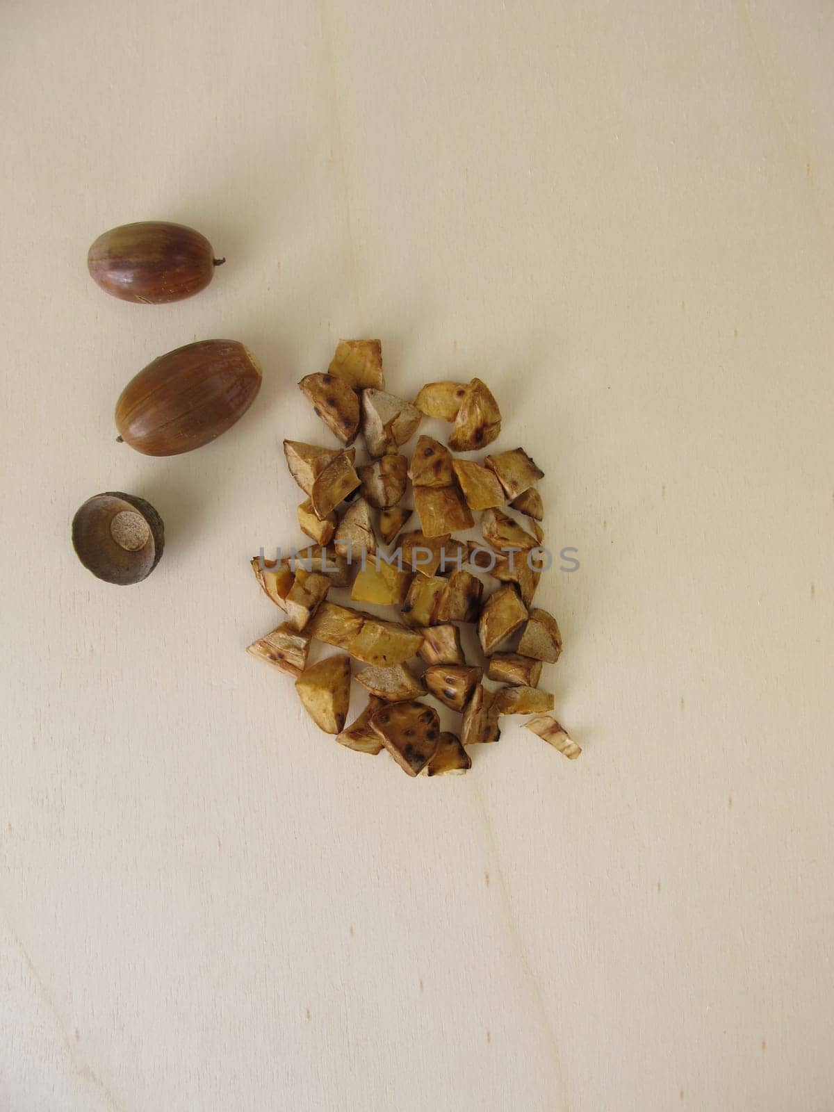 Roasted acorns on wooden board