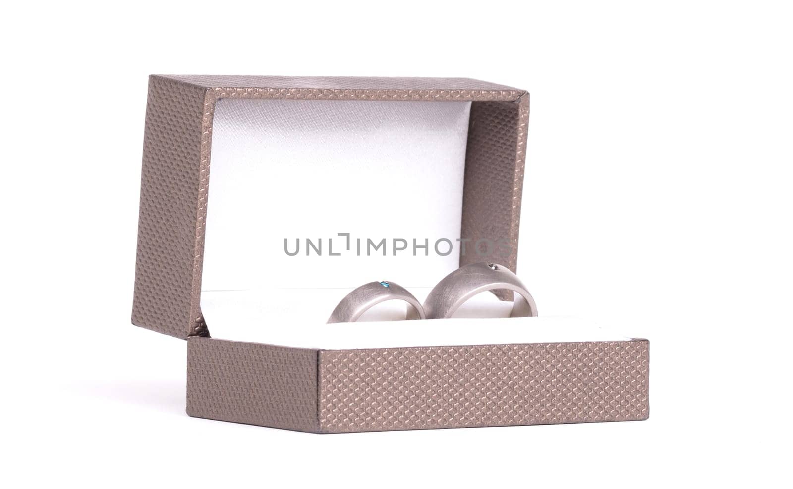 Wedding ring in box, isolated on white background