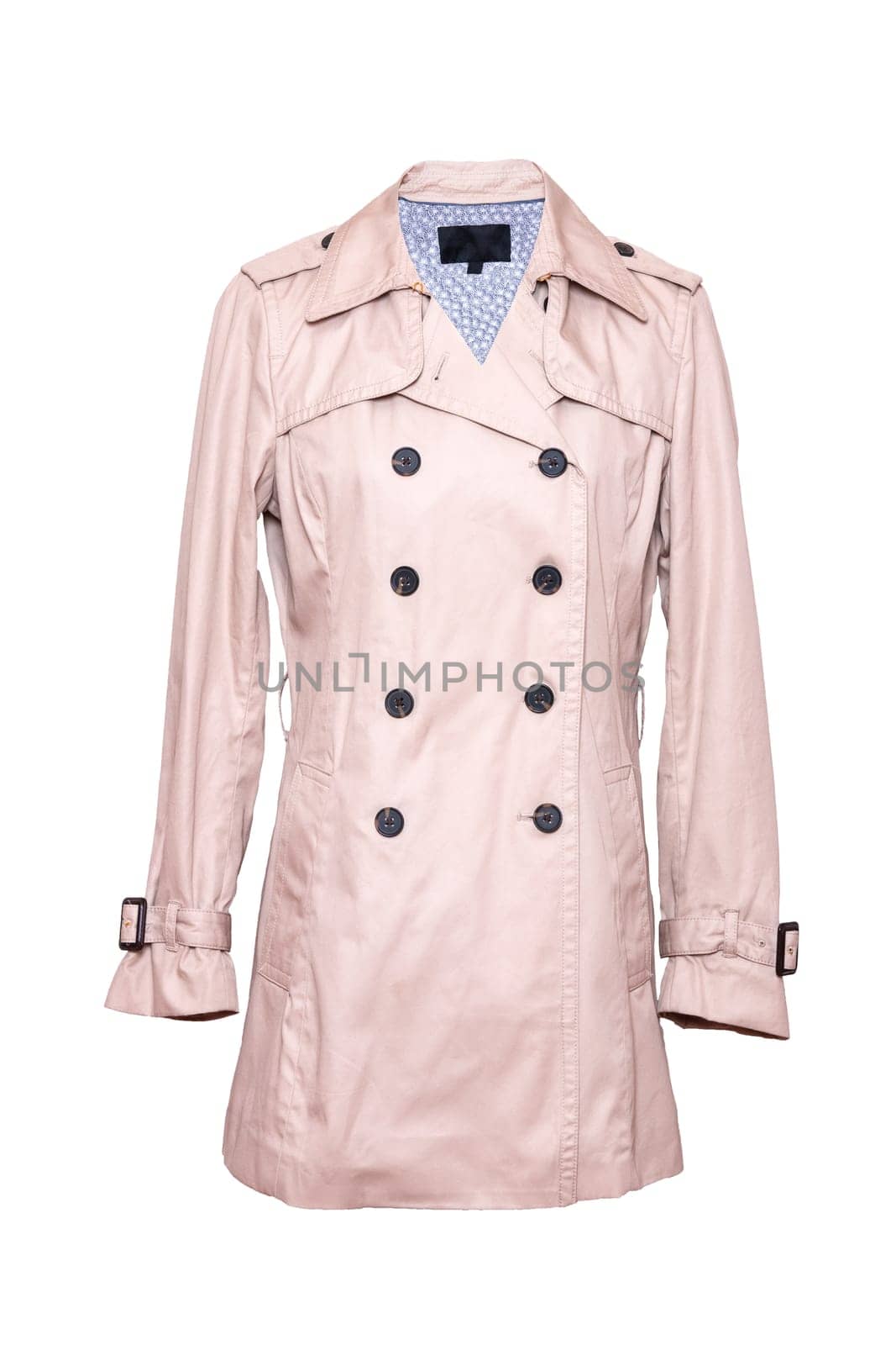 Woman coat isolated. A luxurious and stylish elegant female beige trenchcoat on mannequin isolated on a white background. Spring fashion 2019.