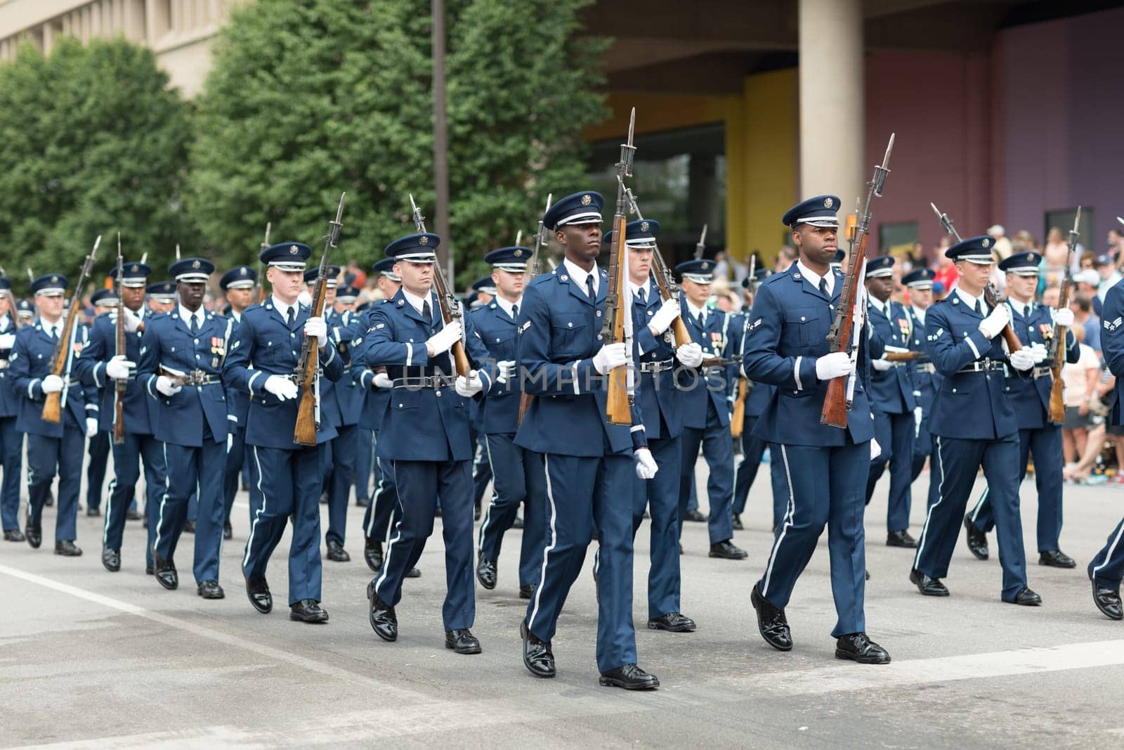 Indianapolis, Indiana, USA - May 26, 2018, Members of the US Air Force march in formation with rifles down the road at the Indy 500 Parade