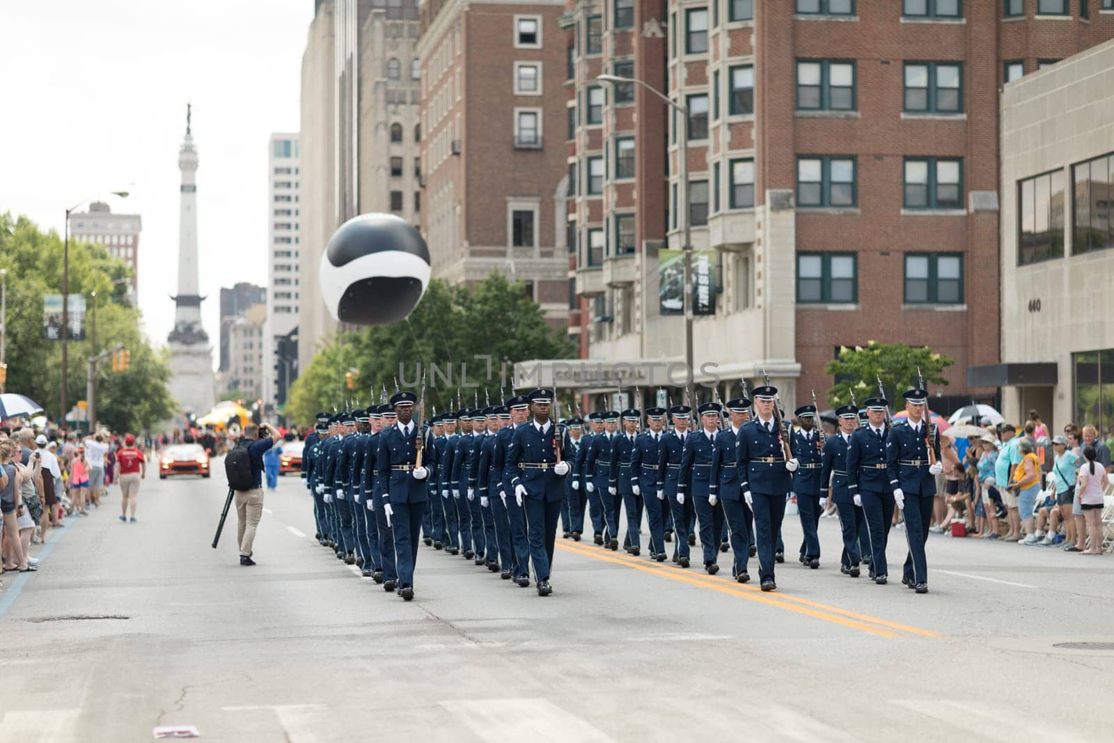 Indianapolis, Indiana, USA - May 26, 2018, Members of the US Air Force march in formation with rifles down the road at the Indy 500 Parade