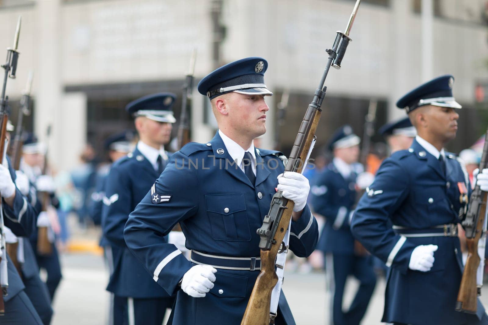 Indianapolis, Indiana, USA - May 26, 2018, Members of the US Air Force march in formation with rifles down the road at the Indy 500 Parade
