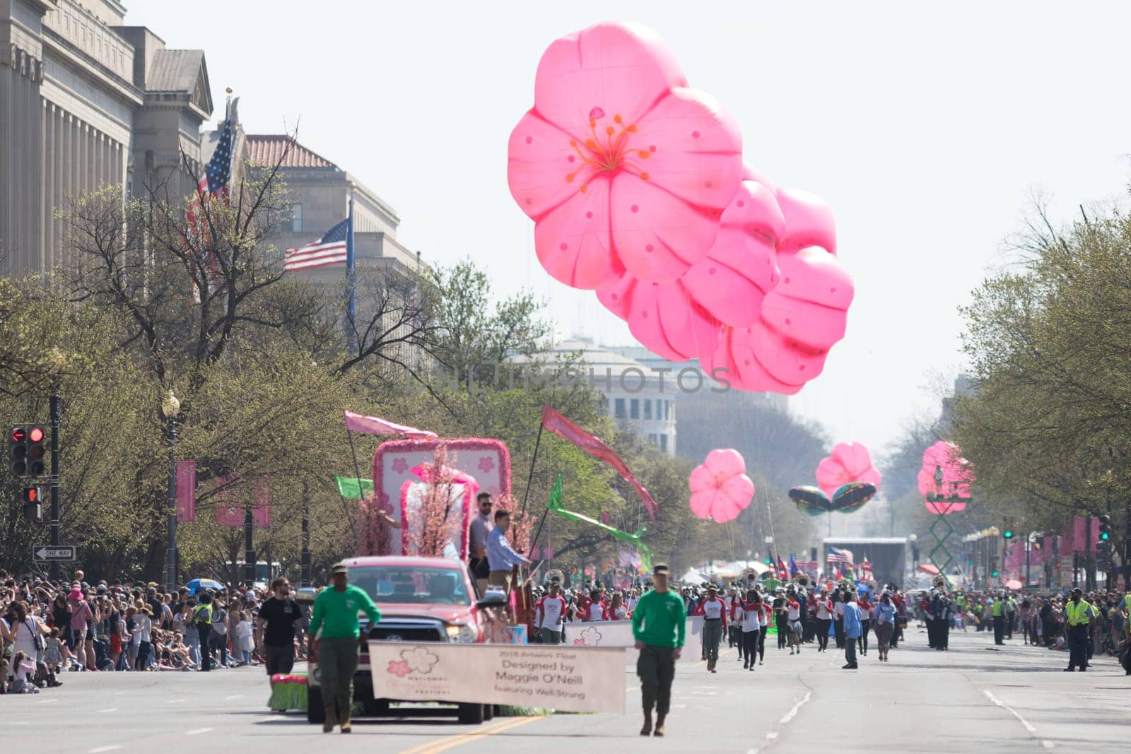 Washington, D.C., USA - April 14, 2018 Floats and  Flower shaped balloons in the 2018 National Cherry Blossom Parade