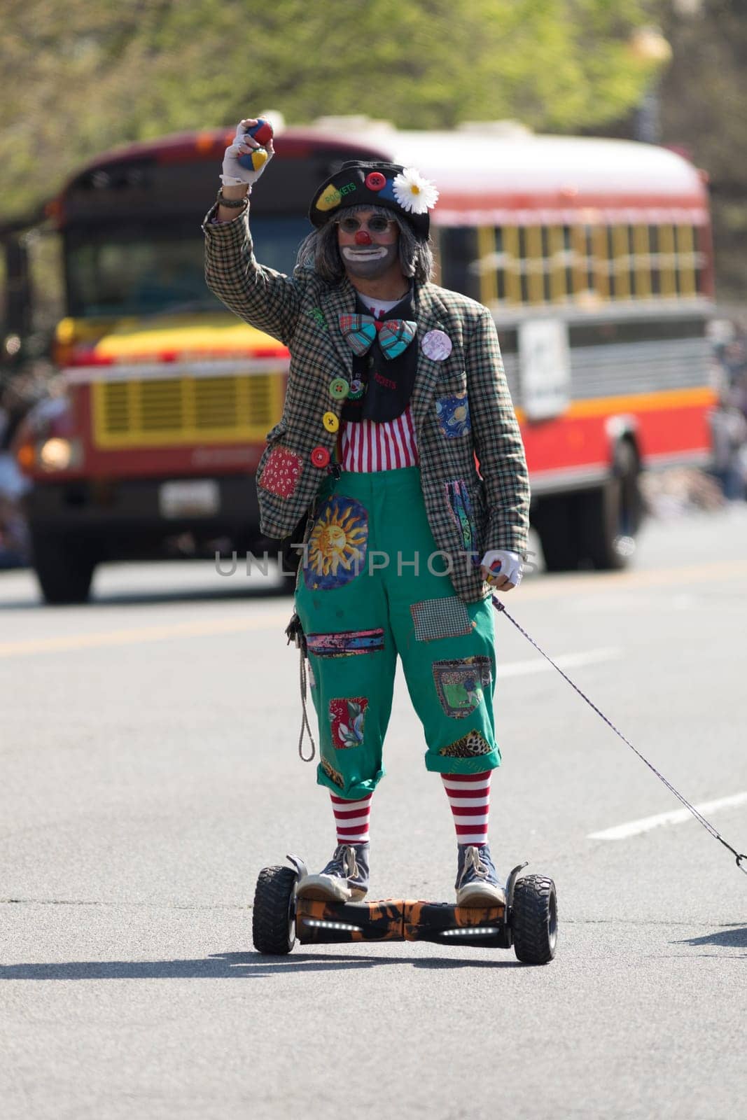 Washington, D.C., USA - April 14, 2018 Clowns going down the street in the 2018 National Cherry Blossom Parade