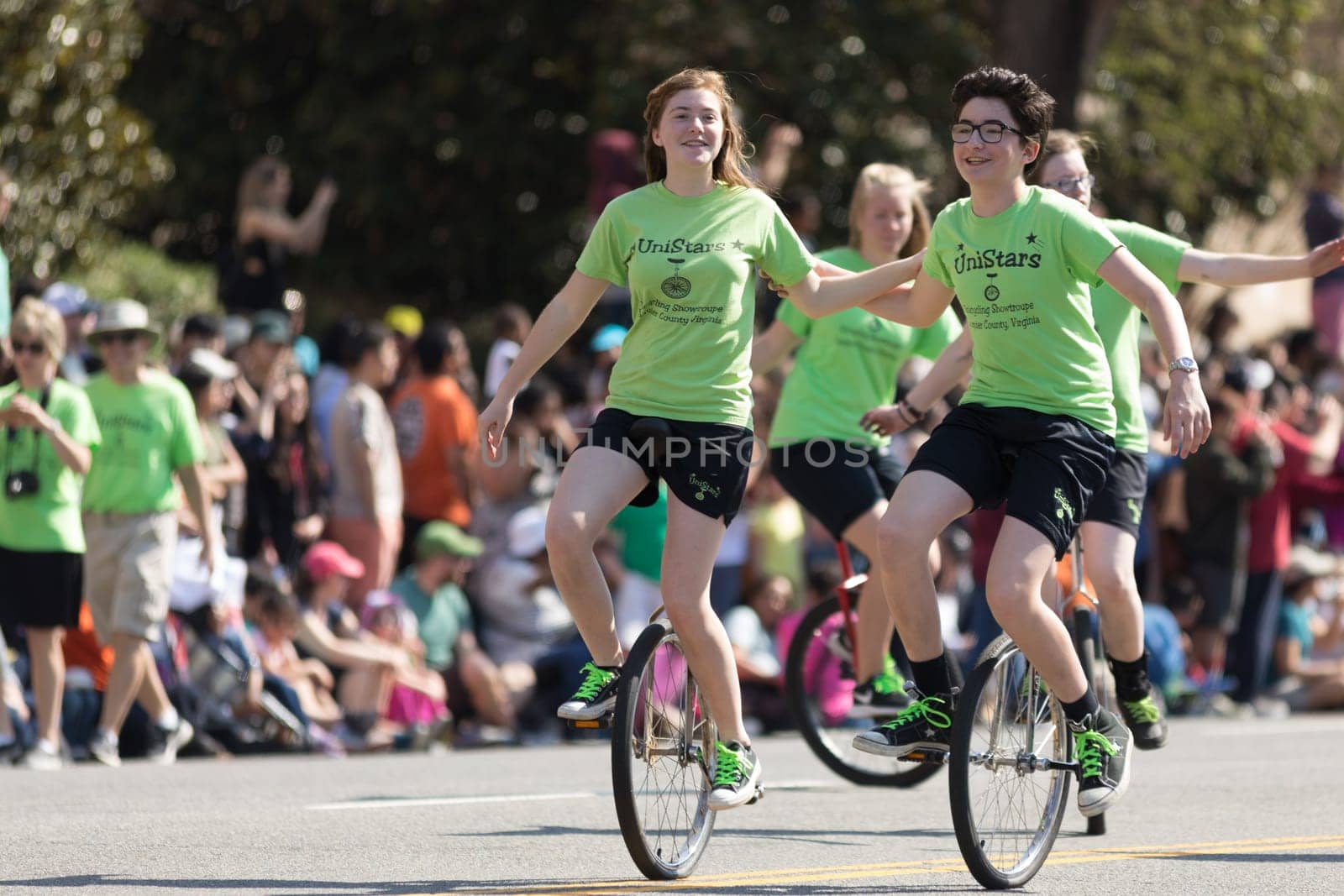 Washington, D.C., USA - April 14, 2018 Children riding unicycles in the 2018 National Cherry Blossom Parade