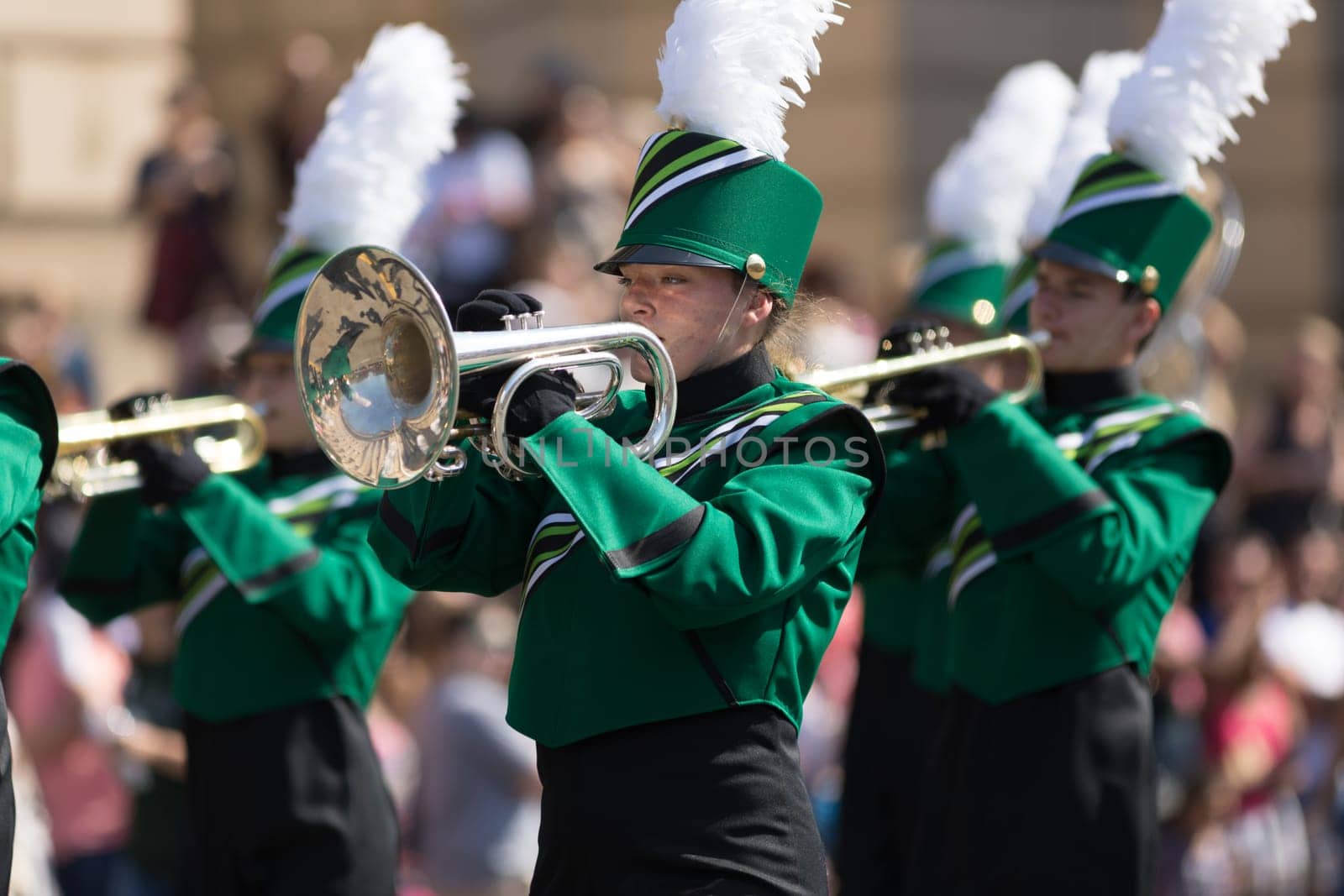 Washington, D.C., USA - April 14, 2018 Marching Band members playing trumpets in the 2018 National Cherry Blossom Parade