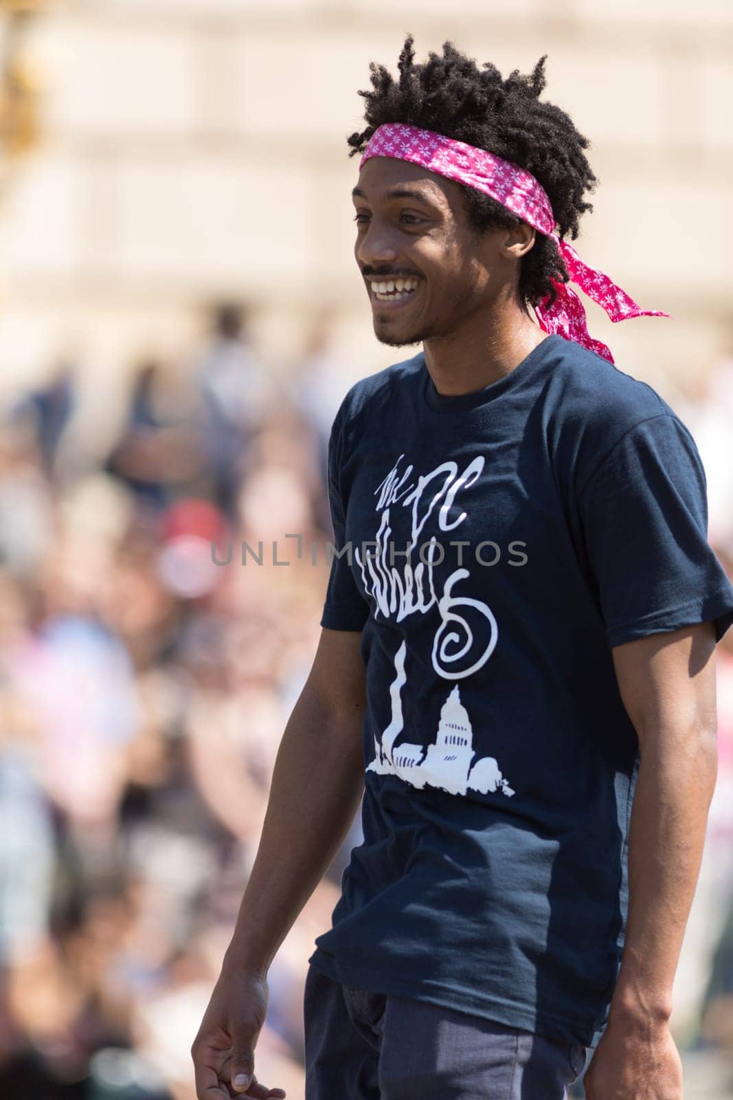 Washington, D.C., USA - April 14, 2018 Men skateboarding in the 2018 National Cherry Blossom Parade