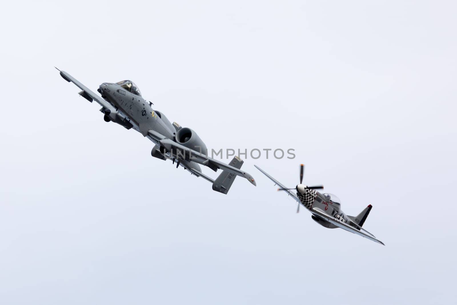 Louisville, Kentucky, USA - April 21, 2018 A-10 Thunderbolt and a P-51 Mustang in formation at the Thunder Over Louisville